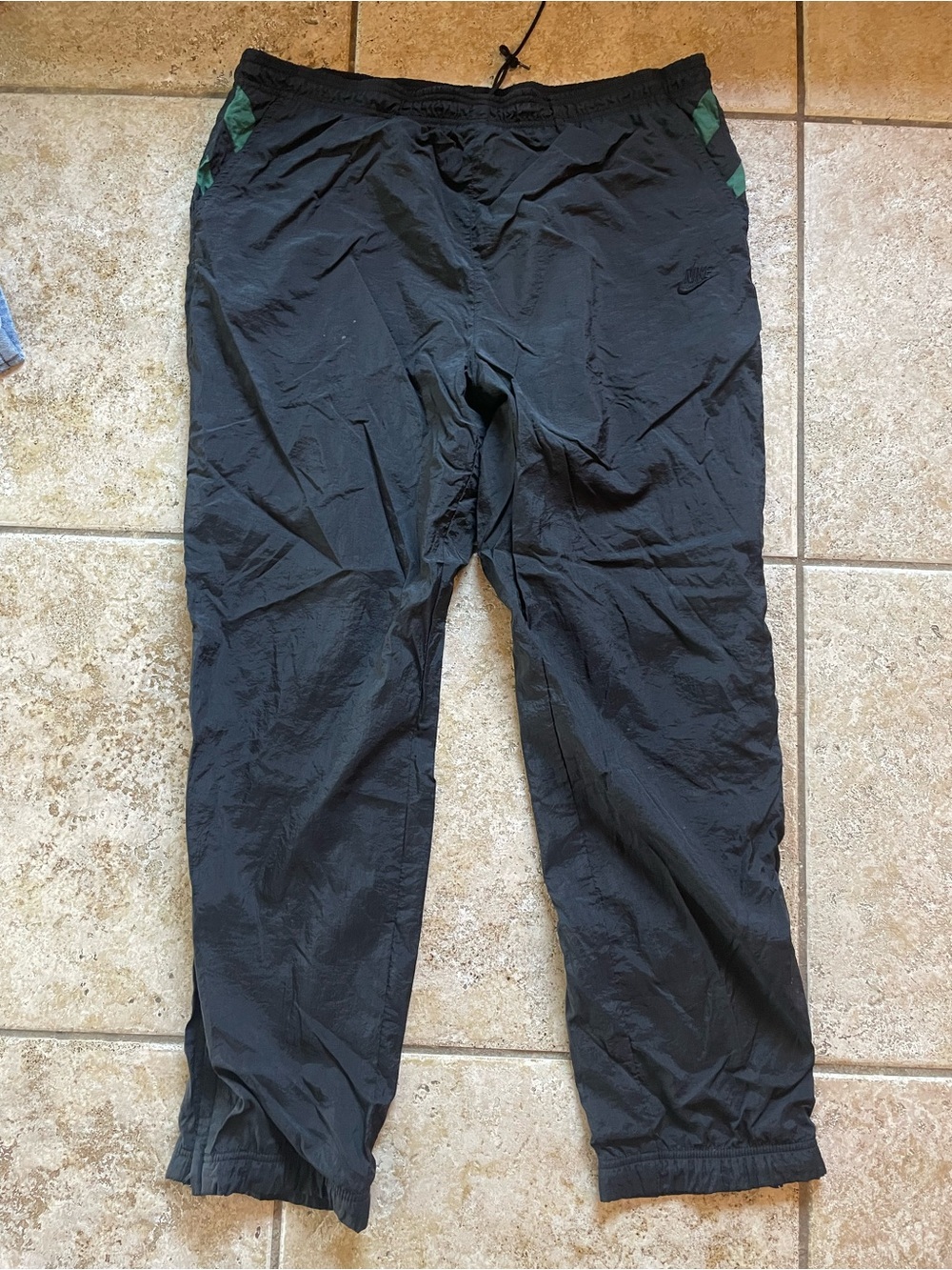 Nike Black Joggers with Green Pocket Accents